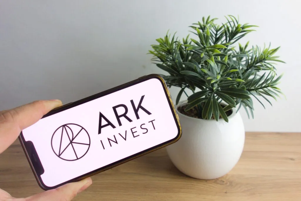 cathie wood's ark buys 74,792 more coinbase shares | invezz